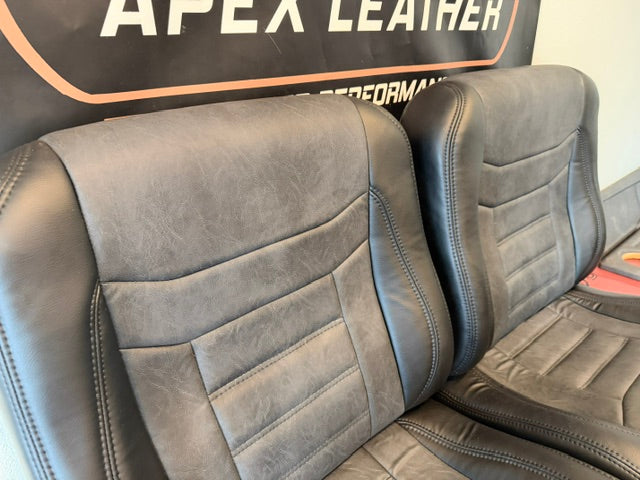 Universal Bucket Seats – Black Ebony Vinyl with Distressed Black Inserts (In Stock)