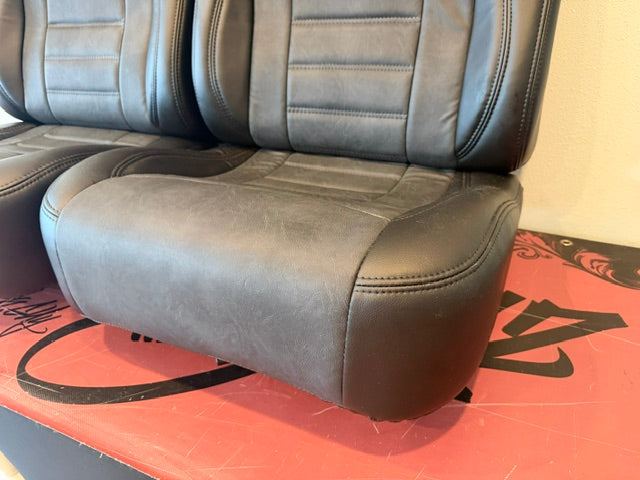 Universal Bucket Seats – Black Ebony Vinyl with Distressed Black Inserts (In Stock)